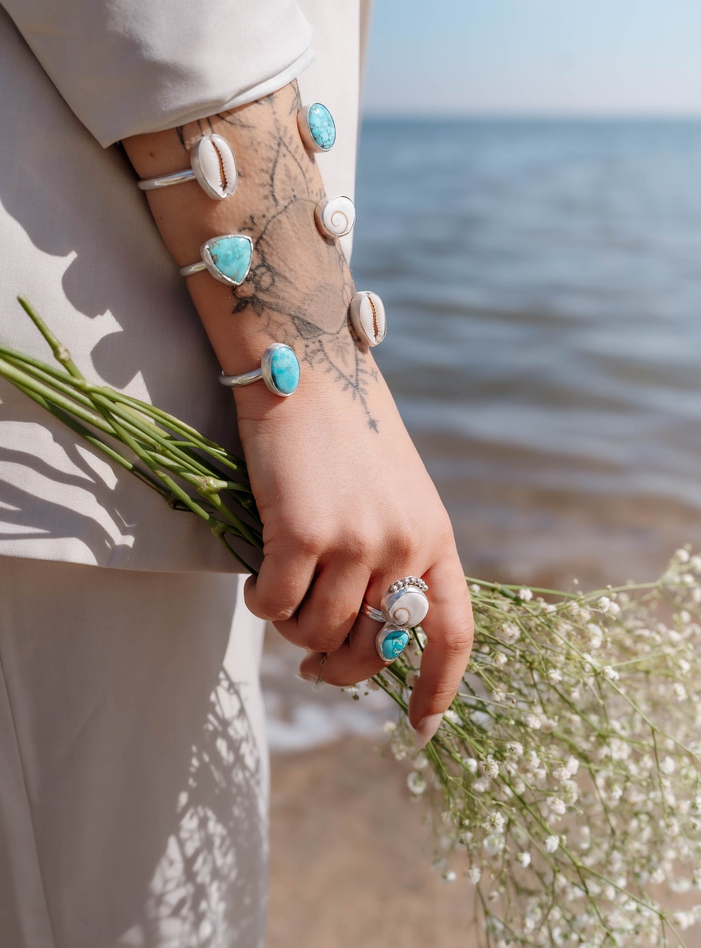 Turquoise and cowrie open cuff