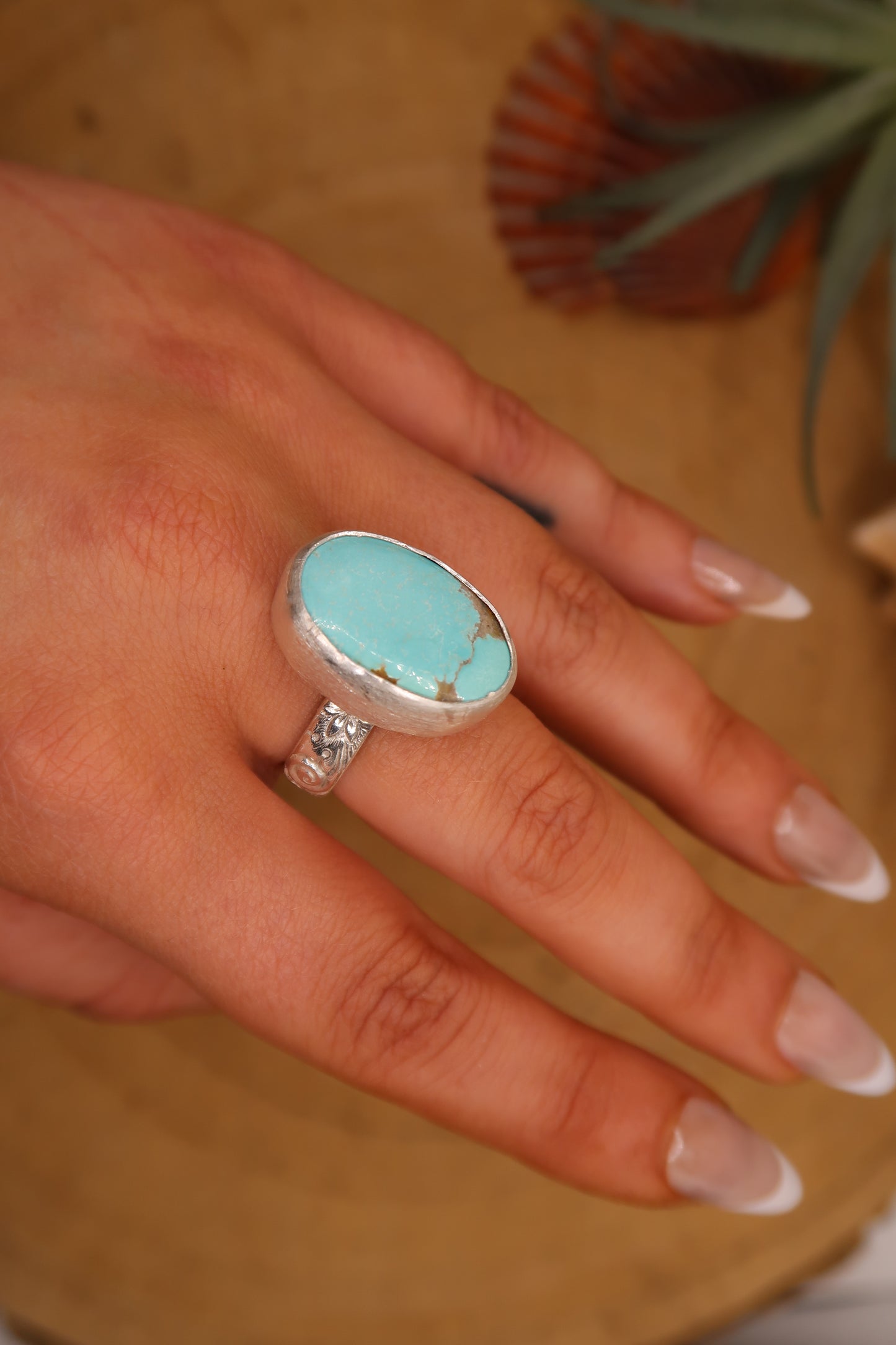 Big turquoise on flower swirl band size 6.5