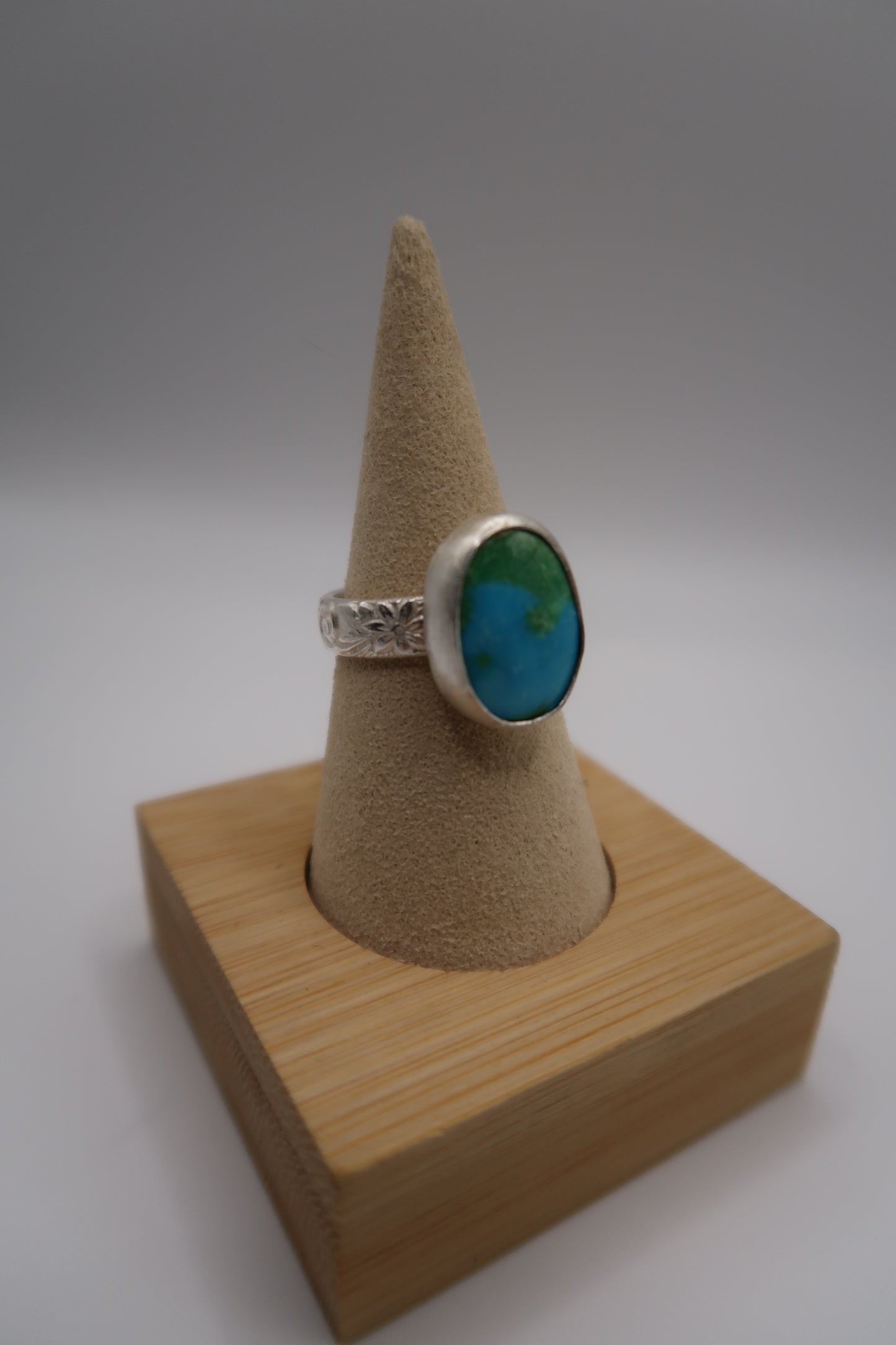 The Earth ring on flower swirl band size 8