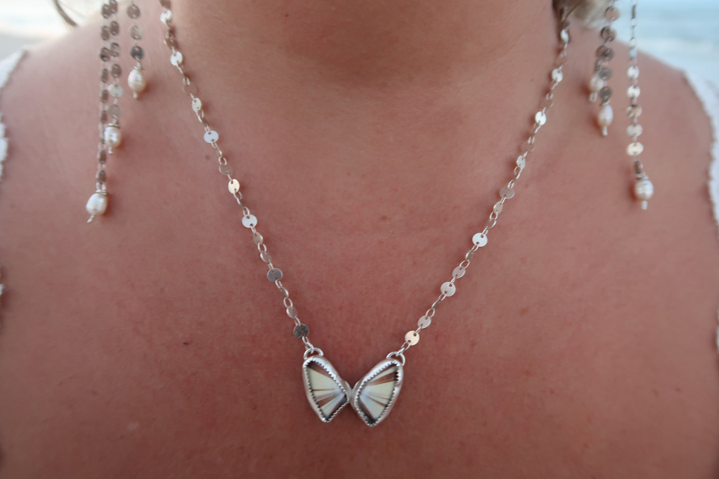 Butterfly shell necklace on sterling silver 18” disc chain