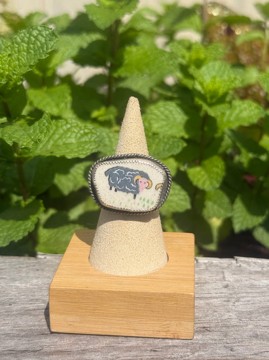 Black sheep ceramic ring on floral band size 7